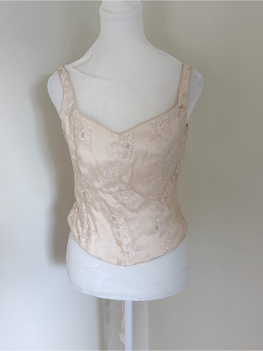 vintage cream bustier top featuring delicate floral embroidery and subtle beadin